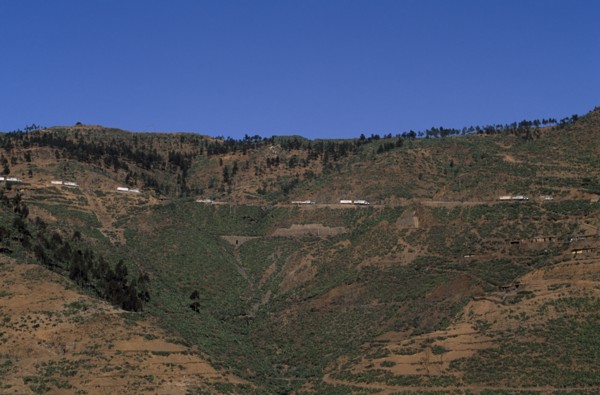 ERITREA, Aid, Distant view towards UN relief convoy of World Food Programme trucks on high Asmara -