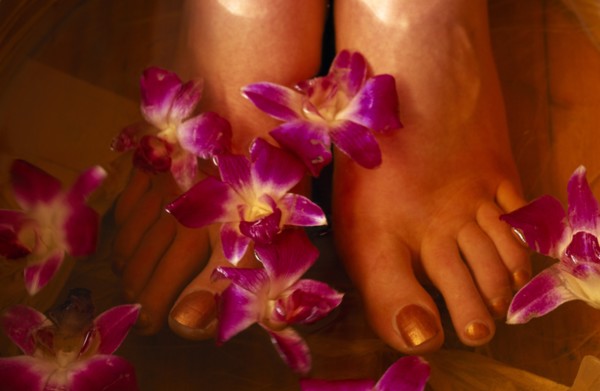 CHINA, Beijing, Bodhi Theraputic Retreat.  Close cropped shot of feet soaking in water scattered