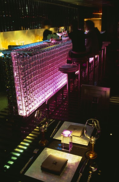 CHINA, Beijing, Tou Ming Si Kao ( TMSK ) bar interior with couple sitting at glass bar illuminated