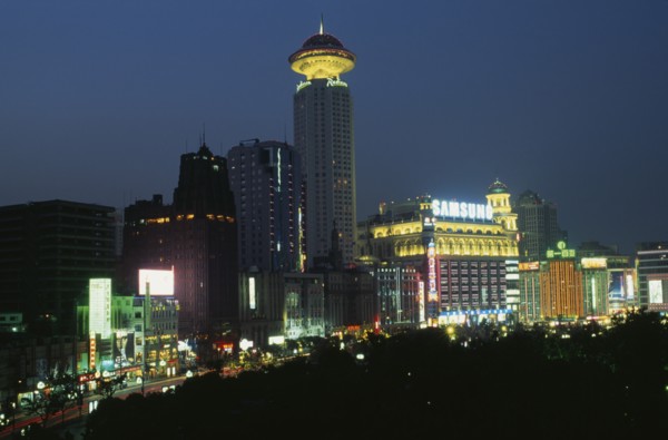CHINA, Shanghai, "Renmin Square or the People’s Square at night, with buildings illuminated with