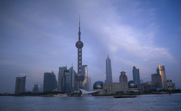 CHINA, Shanghai, Pudong skyline at dusk with skyscrapers including the Oriental Pearl Tower and the