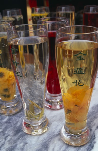 CHINA, Beijing, Selection of teas in tall glasses.