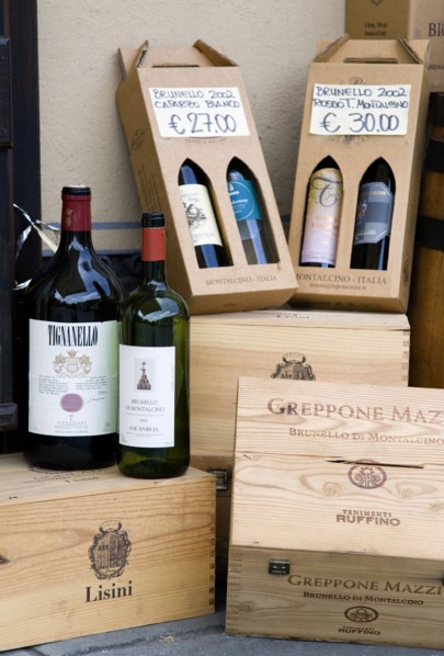 ITALY, Tuscany, Montalcino, Wine shop in the medieval hilltown with a display of wine bottles and