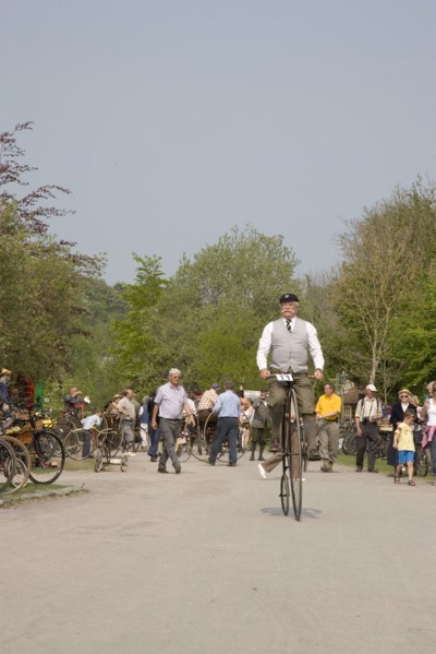 ENGLAND, West Sussex, Amberley, Amberley Working Museum. Veteran Cycle Day Grand Parade. Man
