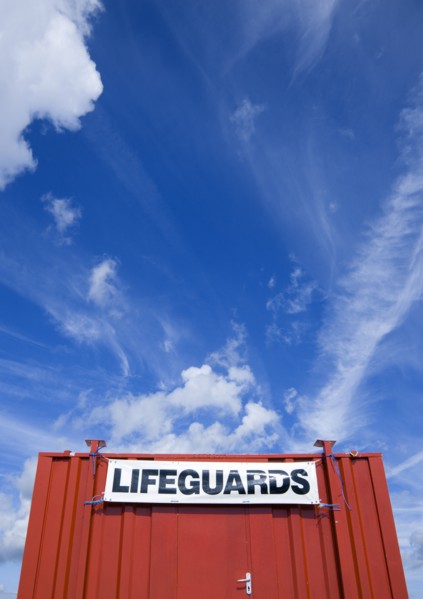ENGLAND, West Sussex, Littlehampton, Red shipping container used as a lifeguards hut on the beach