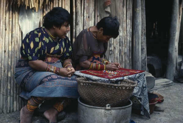 PANAMA, San Blas Islands, Kuna Indians, Kuna Indian women sewing together different layers of cut
