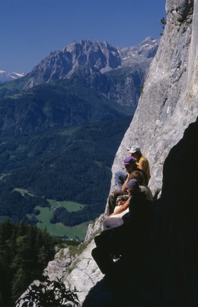 AUSTRIA, Salzburg, Eisriesenwelt, "Group of hikers at cave entrance near Werfen looking out over