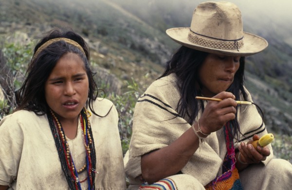 COLOMBIA, Sierra Nevada de Santa Marta, Ika, Ika shepherd sitting beside his sister in the high