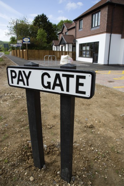 ENGLAND, West Sussex, Washington, To Let signs on wooden fencing outside a newly built housing