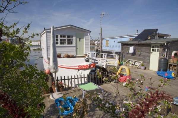 ENGLAND, West Sussex, Shoreham-by-Sea, Houseboat moored along the banks of the river adur.  Former