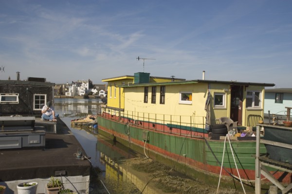 ENGLAND, West Sussex, Shoreham-by-Sea, Houseboat moored along the banks of the river adur.  Former