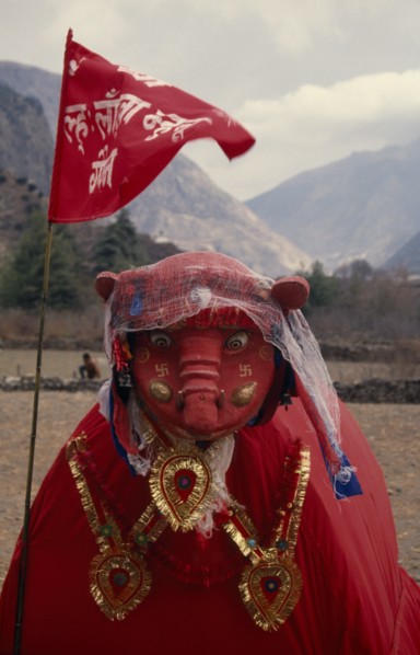 NEPAL, Annapurna Region, Larjung, Circuit Trek. Red painted animal totem representing the God of