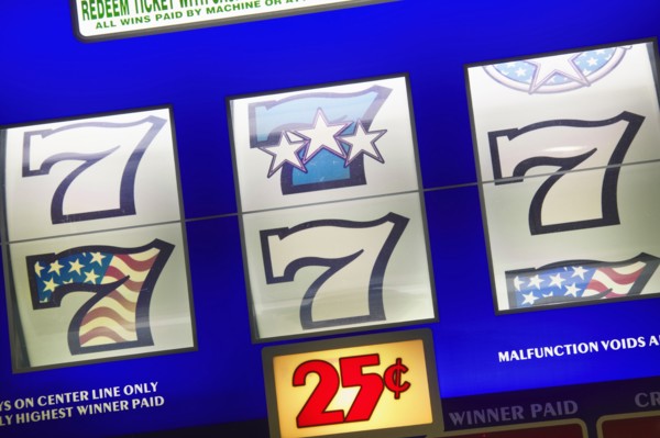 20091068 Detail slot machine dials showing lucky number seven 25 cents play. Gambling  Casino 7 American North America United States America  Region - North AmericaLeisure ActivitiesDominant Blue Jo...