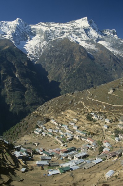 NEPAL, Everest Trek, Namche Bazaar, Elevated view over village rooftops of Namche Bazaar with