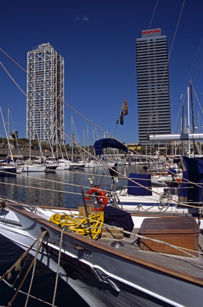 SPAIN, Catalonia, Barcelona, "Port Olimpic, Bow of yacht, marina, Hotel Arts and Torre Mapfre"