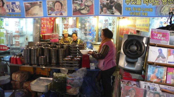 KOREA, South, Seoul, "Namdaemun market, street restaurant, women getting ready for the evening's