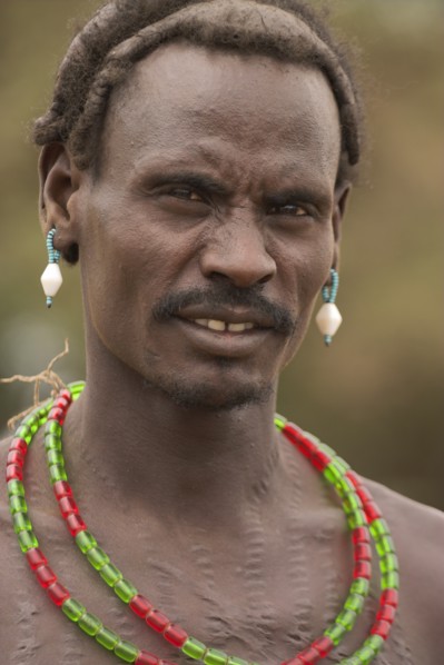 ETHIOPIA, Lower Omo Valley, Village near Omorate, Dassanech man