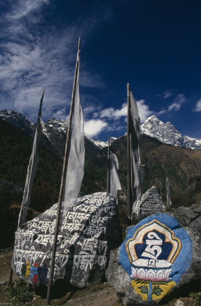 NEPAL, Everest Trek, Ghat, Mani Stones and Prayer Flags in Ghat Village.