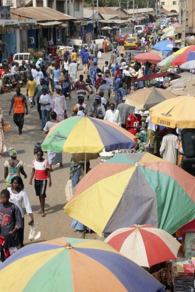 GAMBIA, Western Gambia, Serekunda, "Bakau Market, Atlantic Road.  Busy city street lined with