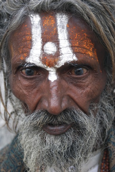 INDIA, Rajasthan, Udaipur, "Portrait of elderly, male Hindu beggar with grey beard and painted