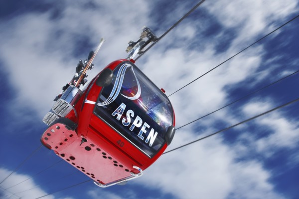 20091058 View cable car ski lift against blue sky with clouds. North America United States America White  WeatherTravelTransportDominant RedDominant WhiteDominant BlueRegion - North America Jon ...