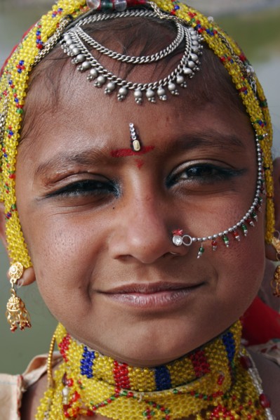 INDIA, Rajasthan, Jodhpur, Portrait of a young Indian girl at Meherangarh Fort wearing nose ring
