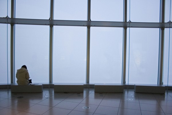 JAPAN, Honshu, Tokyo, Woman sitting alone at one of the benches in the Tokyo Art Museum and