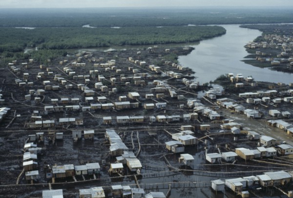 ECUADOR, Guayas Province, Guayaquil , Aerial view over slum housing with stilt buildings built over