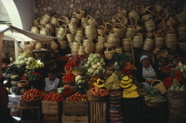 BOLIVIA, Sucre, "Market stall selling fruit , vegetables and locally made baskets"