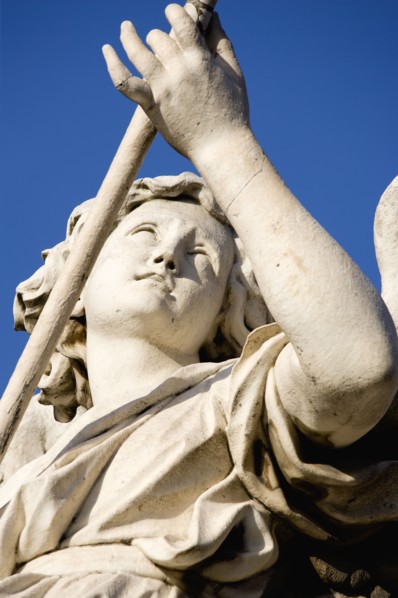 ITALY, Lazio, Rome, Statue of a winged female angel on the Ponte Sant Angelo bridge over the River