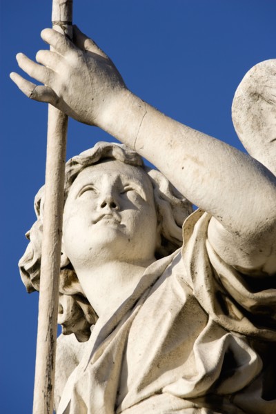 ITALY, Lazio, Rome, Statue of a winged female angel on the Ponte Sant Angelo bridge over the River
