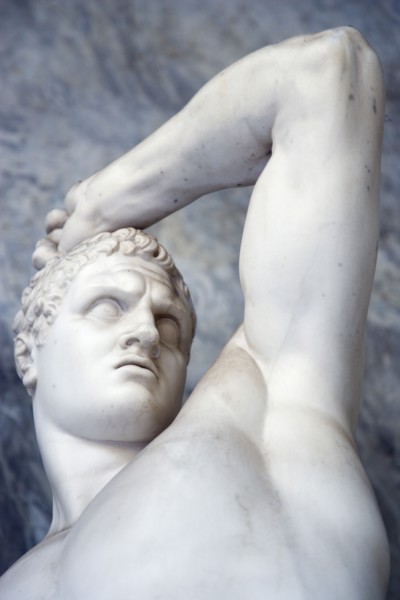 ITALY, Lazio, Rome, Vatican City Museums Statue of a man raising his arm in the Octagonal Courtyard