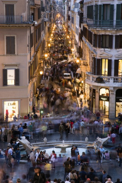 ITALY, Lazio, Rome, The Via dei Condotti the main shopping street busy with people illuminated at