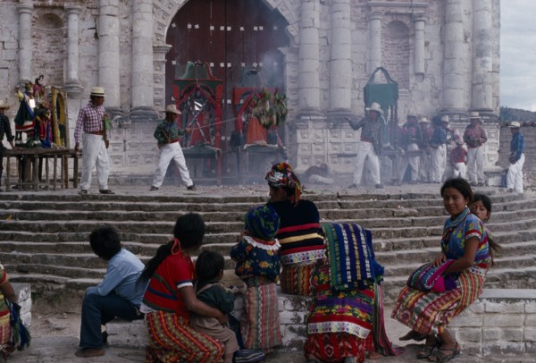 GUATEMALA, El Quiche, San Andres de Sajcabaja, Quiche Indians watching fireworks in front of the