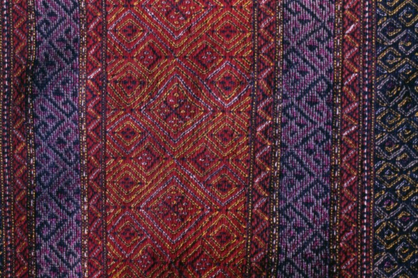 BANGLADESH, Crafts, Textiles, Detail of red and purple woven murang pinon or loin cloth.