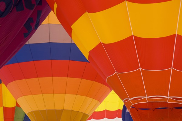 SWITZERLAND, Canton de Vaud, Chateau d'Oex, Patterns of a number of inflated Hot Air Balloons close