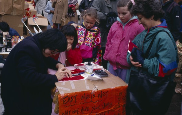 ENGLAND, London, Chinese New Year, Calligraphist writing Western names in Chinese during New Year