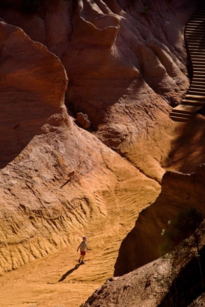 FRANCE, Provence Cote d’Azur, Le Sentier des Ocres (The Ochre Footpath) , "Small boy playing on