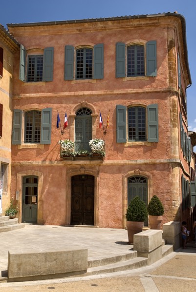 FRANCE, Provence Cote d’Azur, Vaucluse, Roussillon.  Exterior facade of building with typical ochre