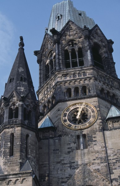 GERMANY, Berlin, Kaiser Wilhelm Memorial Church. Part view of ruined gothic exterior with clock