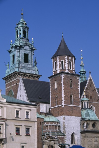 POLAND, Krakow, Detail of Wawel Cathedral exterior with clock tower above second tower and series