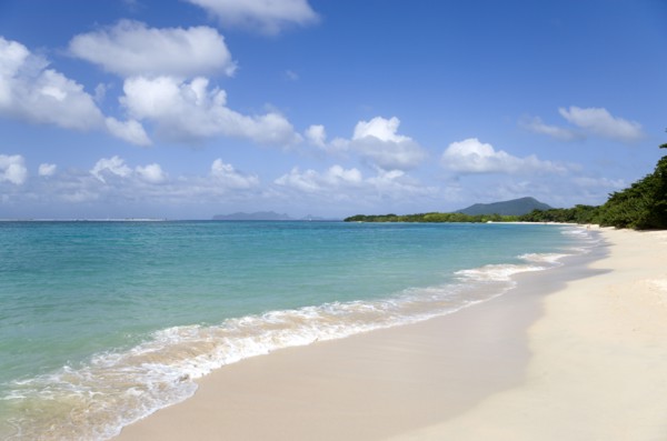 WEST INDIES, Grenada, Carriacou, "The calm clear blue water breaking on Paradise Beach in L'Esterre