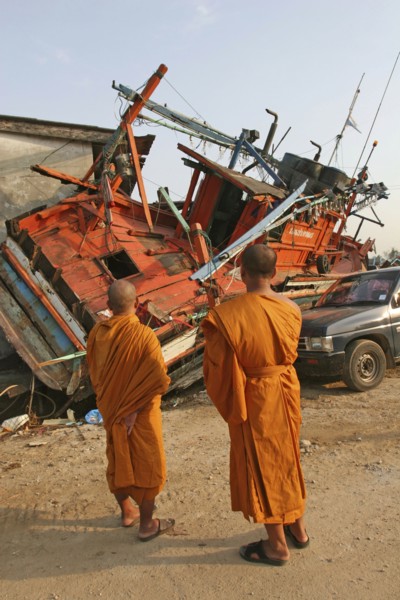 THAILAND, Phang Nga District, Nam Khem, "Tsunami. Monks looks at the damage caused by the tsunami,