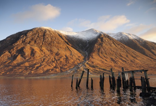 Scotland, Argyll, Loch Etive, Disused jetty with snowy mountains (Ben Starav)