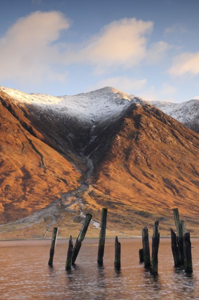 Scotland, Argyll, Loch Etive, Disused jetty with snowy mountains (Ben Starav)