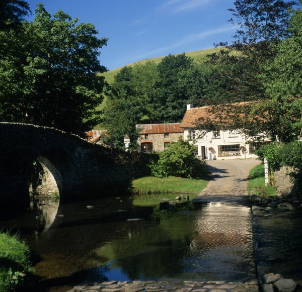 ENGLAND, Devon, Exmoor, Malmsmead on Badgworthy Water. Arched stone bridge and ford across river