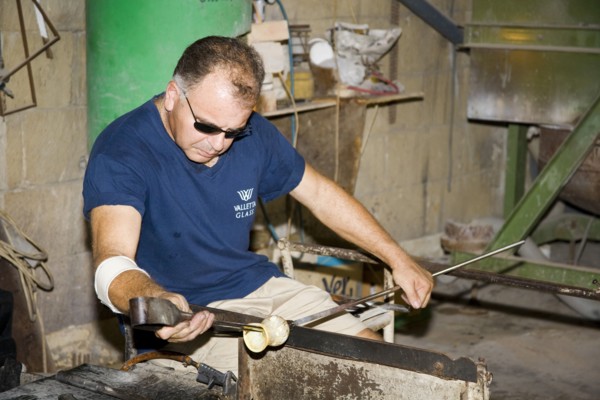 MALTA, Valletta Glass factory, Ta Qali Craft Village, Glass blower manufacturing a glass ornament.