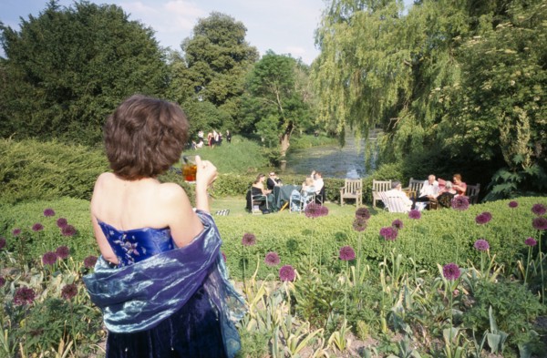 ENGLAND, East Sussex, Glyndebourne, Opera attendees enjoying picnics in the gardens during interval