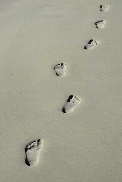 USA, Georgia, Tybee Island, Human footprints in the sand.
