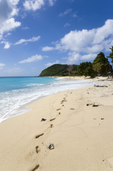WEST INDIES, St Vincent & The Grenadines, Canouan, South Glossy Beach in Glossy bay with footprints